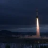 A dramatic scene showing a rocket threat over the Ural region, featuring a large ominous rocket silhouette or missile in the sky above snow-covered taiga forests and industrial cities, with dark stormy clouds and emergency warning lights, rendered in photorealistic-1 style
